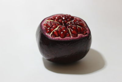 Close-up of strawberry cake against white background