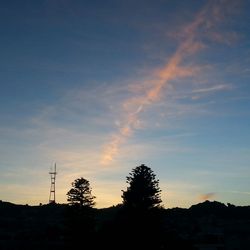 Silhouette of trees against sky at sunset