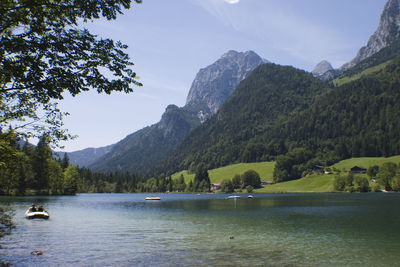 Scenic view of lake and mountains against sky