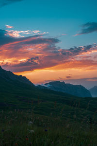 Scenic view of field against sky during sunset