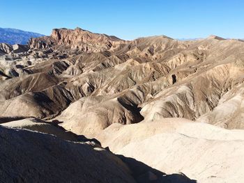 Scenic view of arid landscape against sky