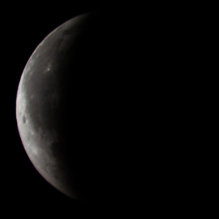 CLOSE-UP OF MOON AGAINST DARK SKY