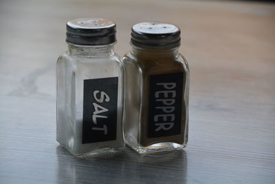 Close-up of salt and pepper shakers on table