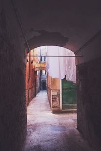 Empty alley along buildings