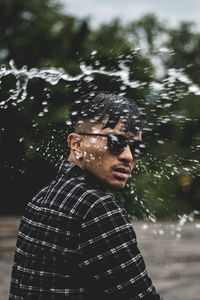 Portrait of young man in water