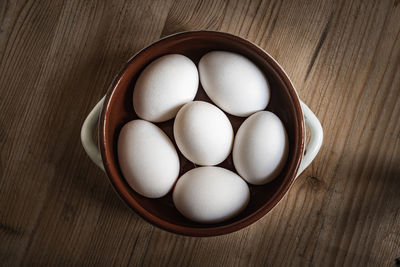 High angle view of eggs in container on table