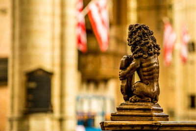 Close-up of statue against building