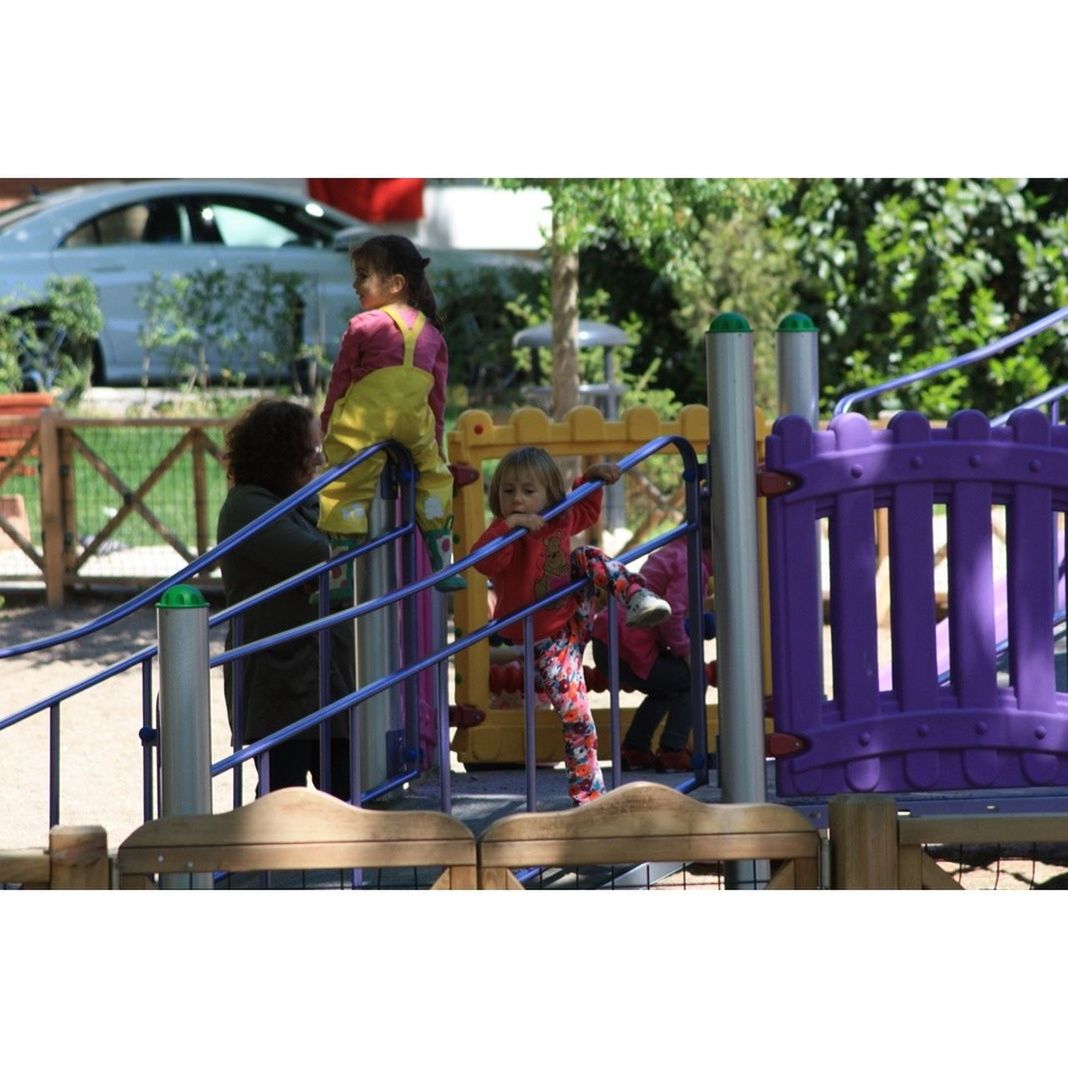 railing, men, lifestyles, leisure activity, tree, built structure, person, metal, architecture, day, bridge - man made structure, sitting, outdoors, transfer print, transportation, connection, playground