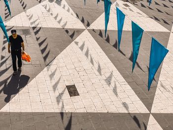 High angle view of man walking on street