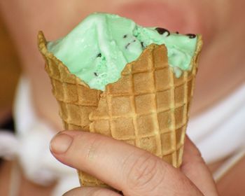 Close-up of hand holding ice cream