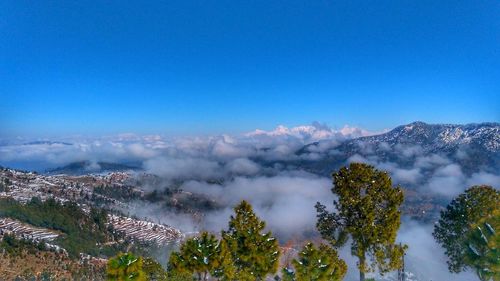 Scenic view of mountains against clear blue sky