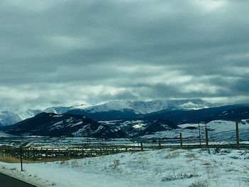 Scenic view of snow covered mountains against sky