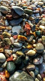 Full frame shot of pebbles in shallow water