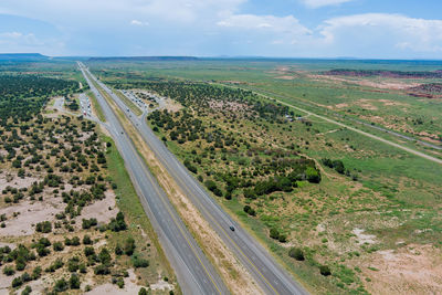 High angle view of road amidst land against sky