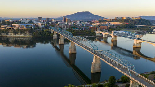 High angle view of bridge over river by buildings in city