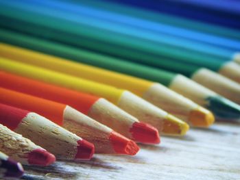 Close-up of colored pencils on table
