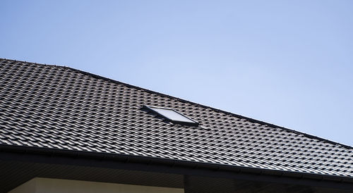 Low angle view of building against blue sky