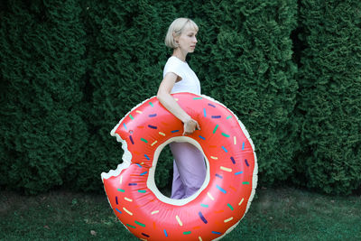 Rear view of woman with inflatable ring