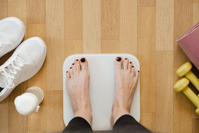 Low section of woman standing on floor