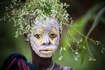 Portrait of woman with flowers