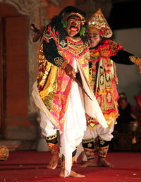 Men performing on stage