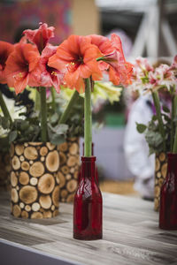 Close-up of red roses in vase on table