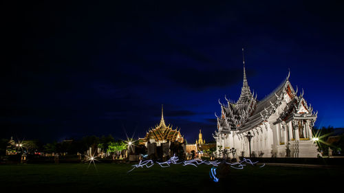 Illuminated buildings in city at night