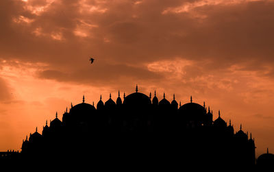 Silhouette of building during sunset