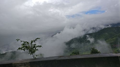 Scenic view of tree mountains against sky