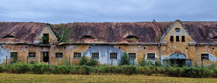 House on field against sky