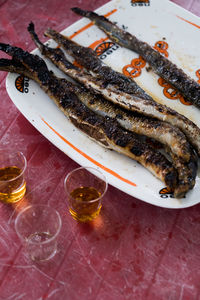 High angle view of fish in plate on table