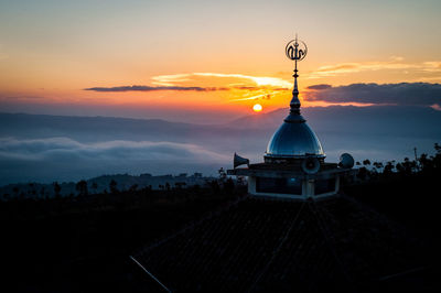 Building against sky during sunset