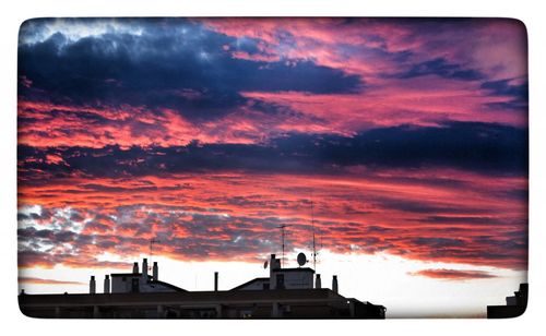 Low angle view of dramatic sky at sunset