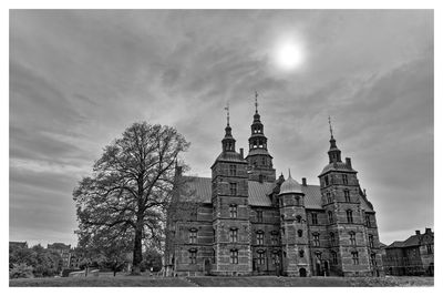 Low angle view of cathedral against cloudy sky