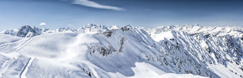 Scenic view of snowcapped mountains against sky