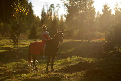 Man riding horse on field