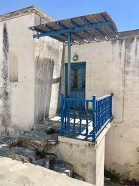 Old abandoned house against blue sky