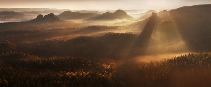 Scenic view of mountains against sky during sunset