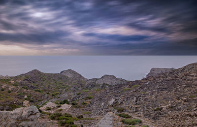 Scenic view of rocky mountains against sky during sunset