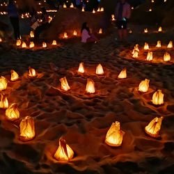 High angle view of lit candles