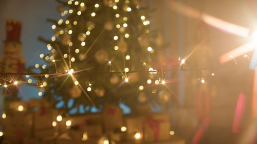 Low angle view of illuminated christmas lights at night