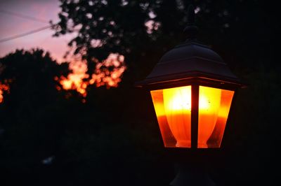 Low angle view of lamp post at night