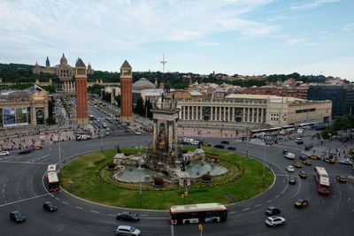 High angle view of city street and buildings against sky