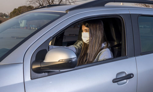 Portrait of woman in car