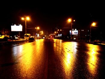 Cars on road in city at night