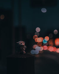 Defocused image of illuminated lights at night