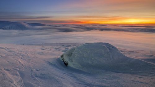 Scenic view of landscape against sky during sunset