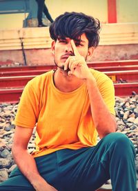 Young woman sitting on bench