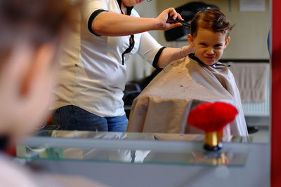 Funny child in hair salon