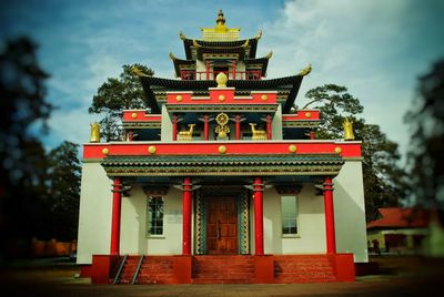 View of temple building against cloudy sky